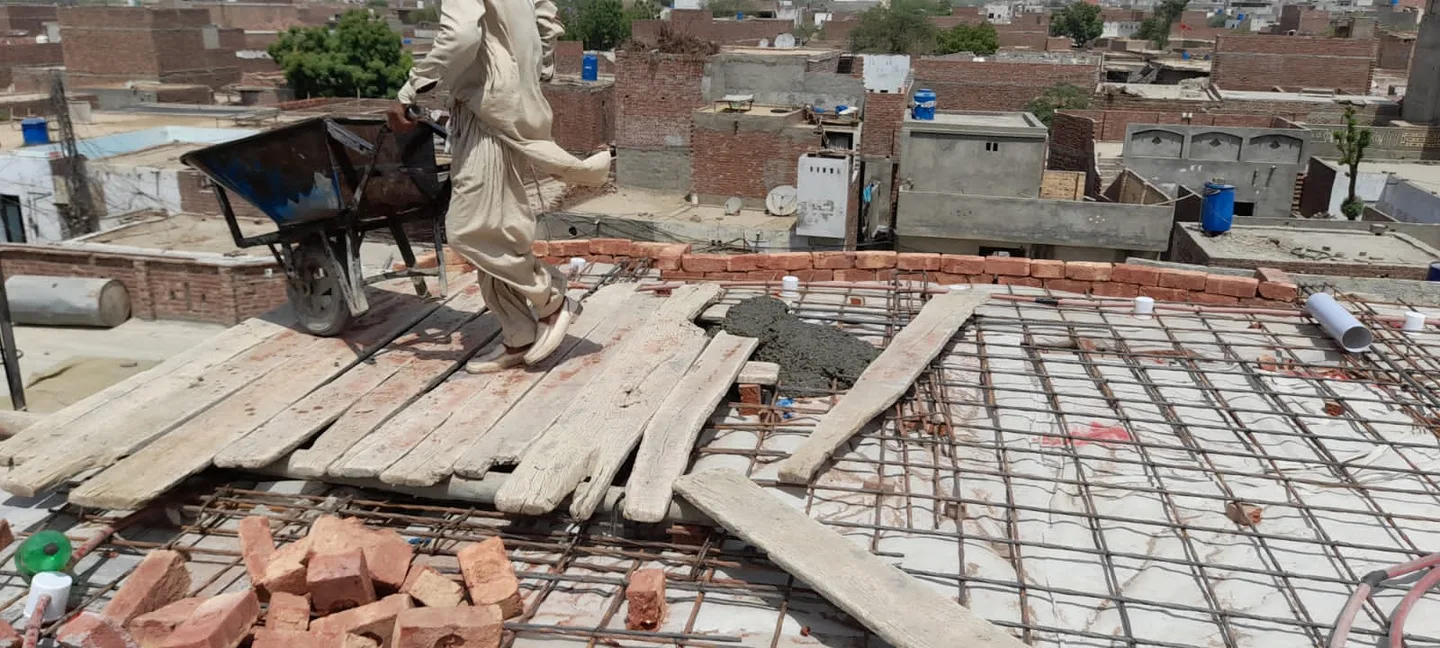 Timber planks and steel reinforcement on a roof