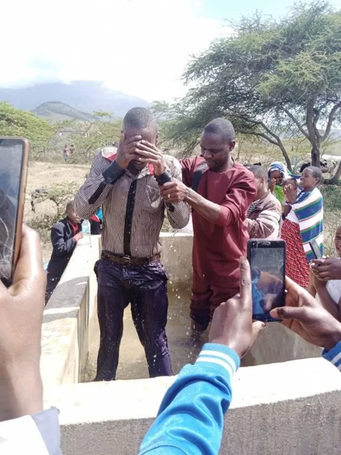 Man at an outdoor baptism