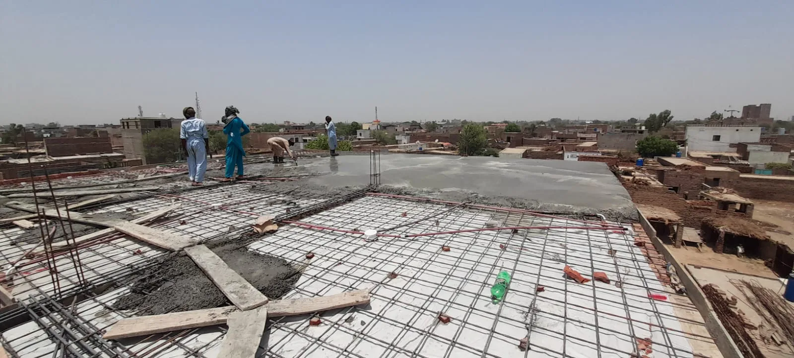 Workers on a roof during concrete construction