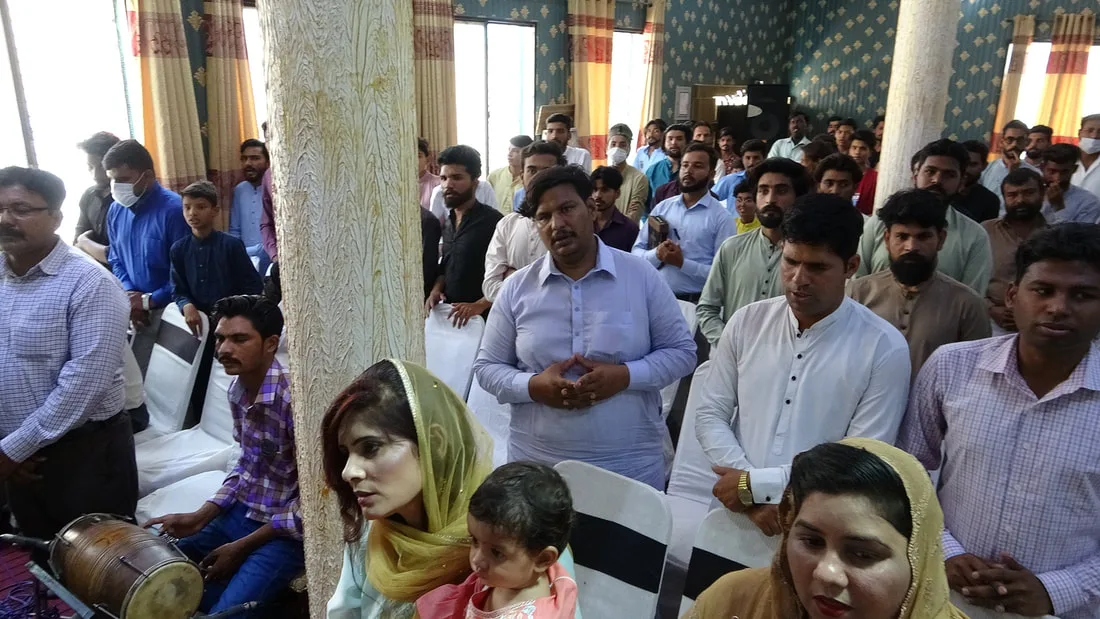 People gathered inside a hall