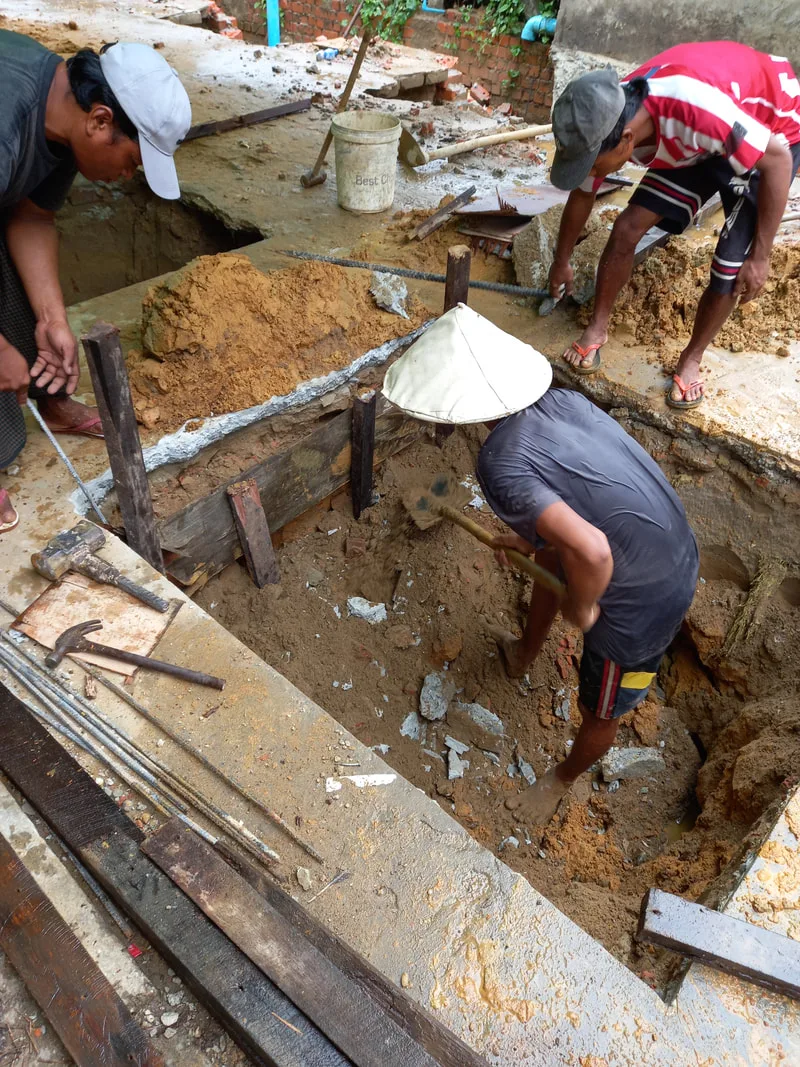Workers digging foundation pits